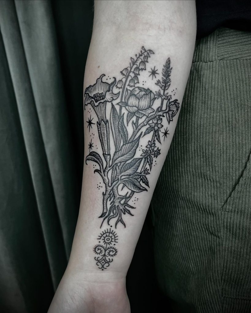 Root & Ritual witchy flower forearm tattoo