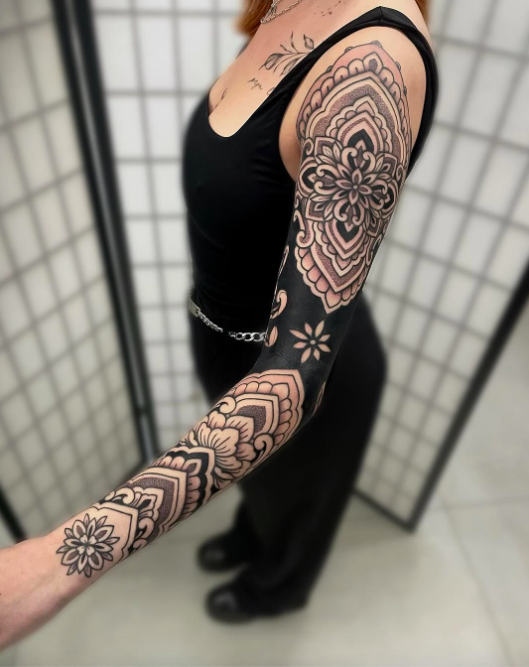 best sacred sleeve tattoo for women