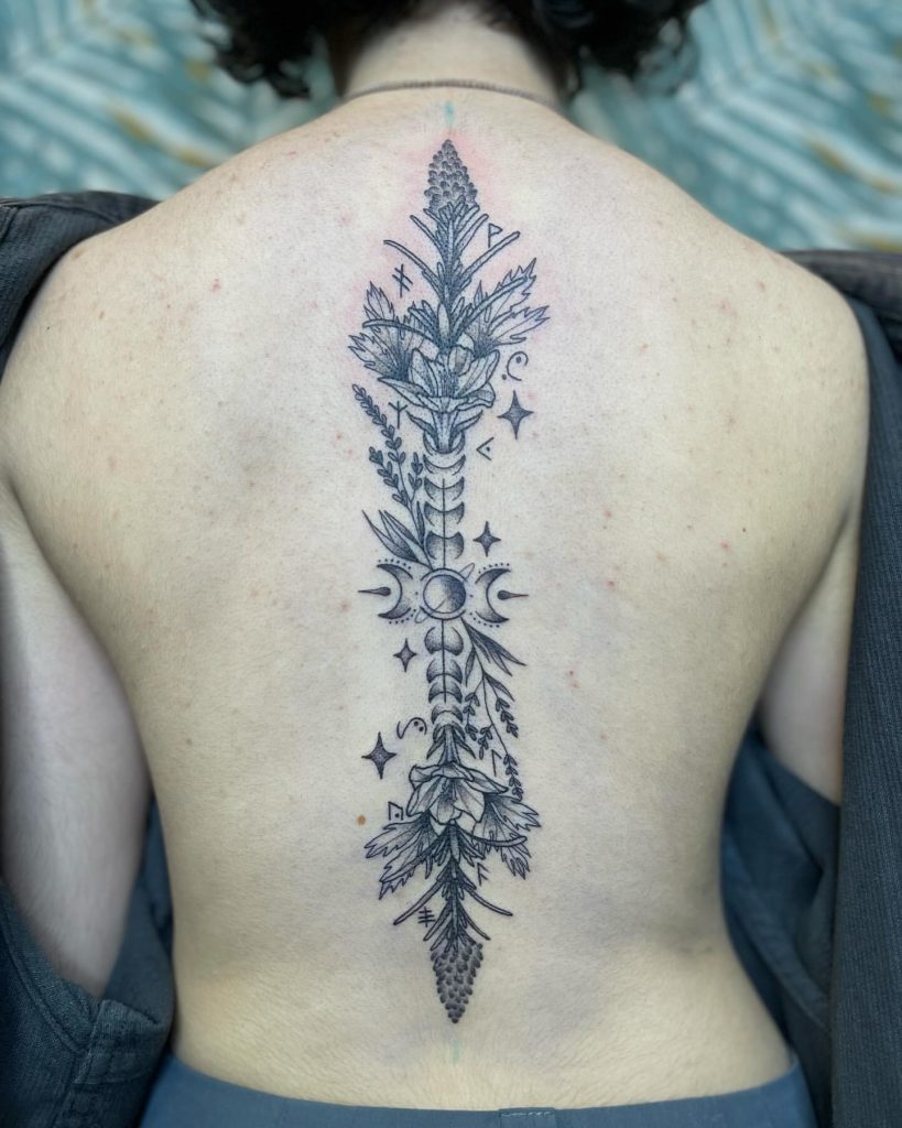 The Lunar Spine witchy flower tattoo